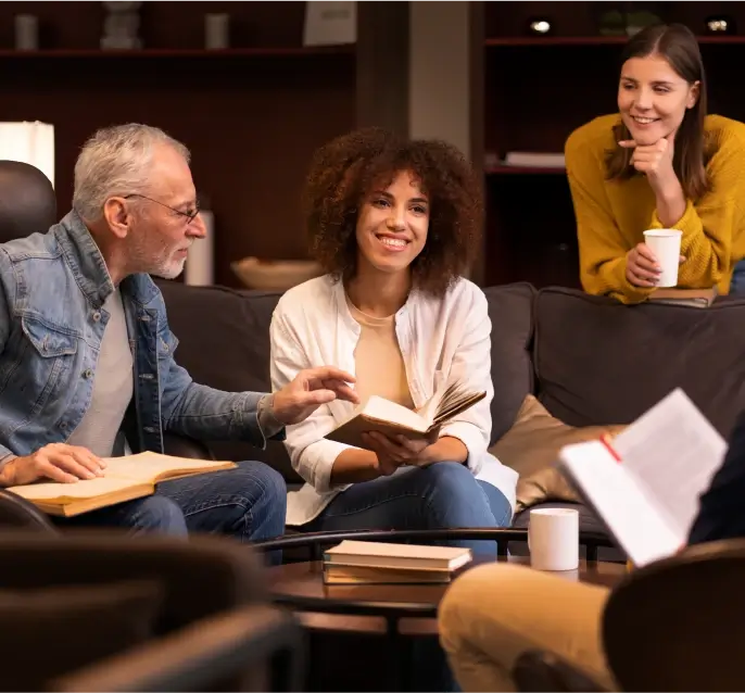 A group of people reading books together