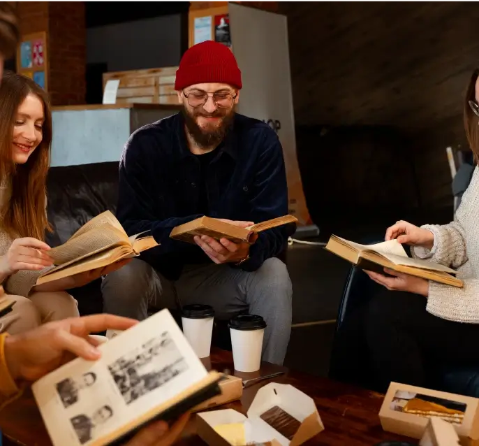 A group of people reading books together