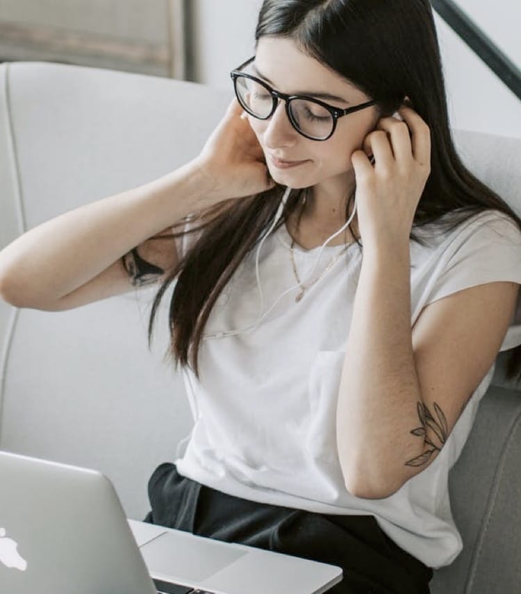 Woman listening to music with headphones on